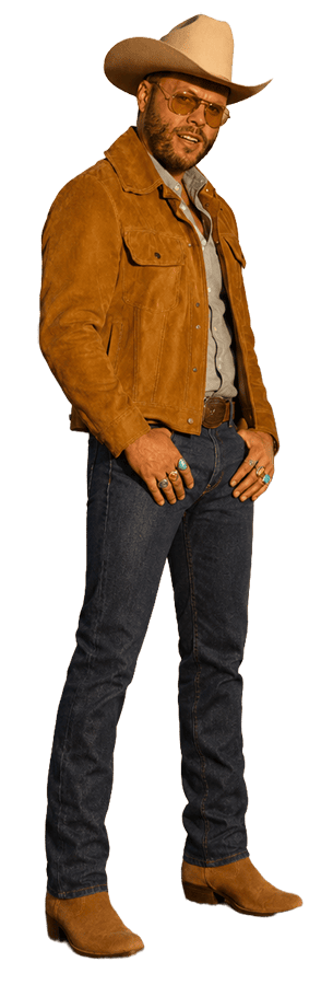 Charley Crockett standing by the train tracks